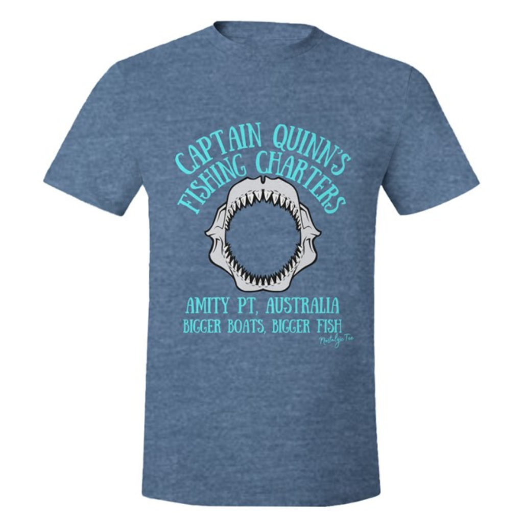 T-shirt featuring a graphic print of a shark jaw with the text 'CAPTAIN QUINN'S FISHING CHARTERS' and 'AMITY PT. AUSTRALIA BIGGER BOATS, BIGGER FISH' in light blue lettering.