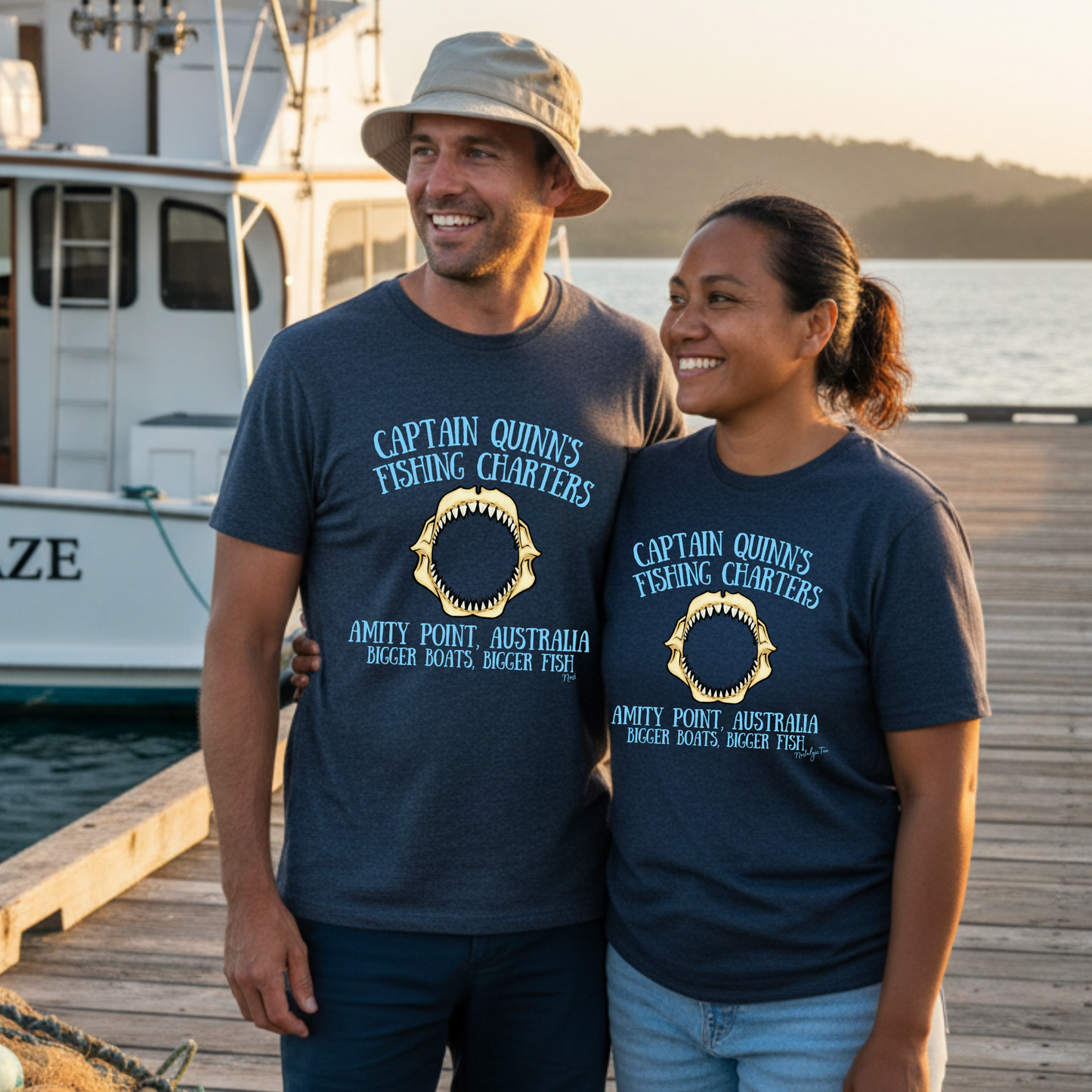 Couple showing off their favorite shark fishing charter t-shirt