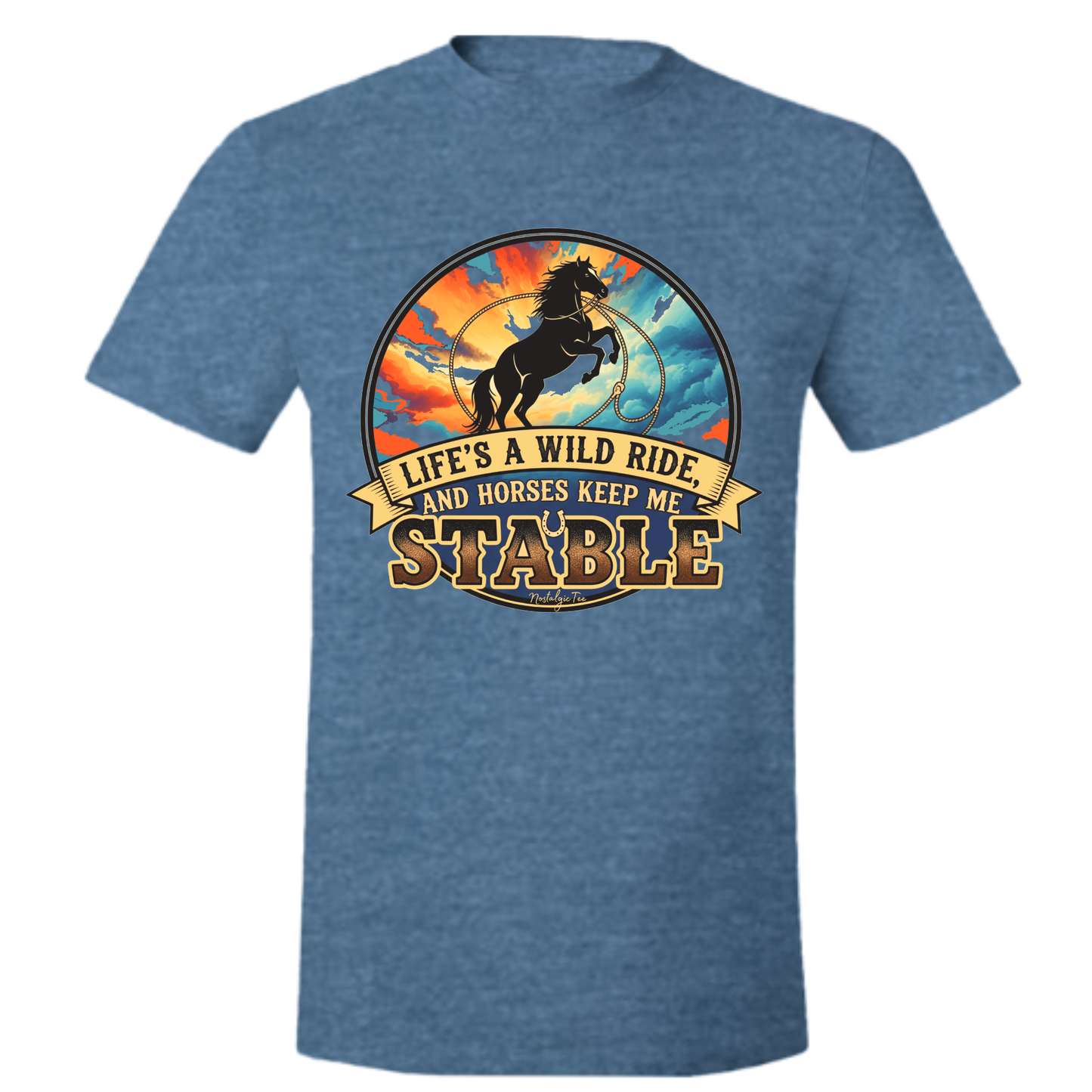 A heather blue short-sleeve t-shirt with a circular graphic on the chest featuring a rearing horse, a golden sunburst, and a banner that reads 'LIFE'S A WILD RIDE, AND HORSES KEEP ME STABLE'.