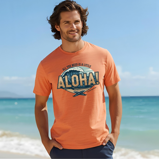Man wearing an orange t-shirt with all you need is a little Aloha design on a beach