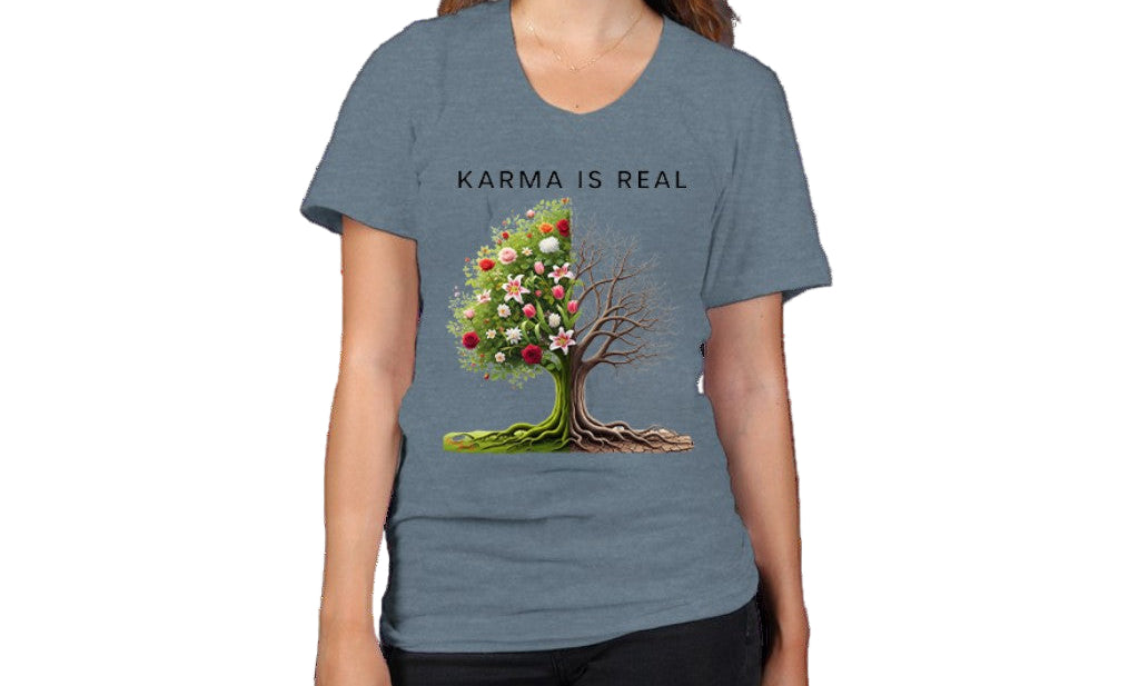 Person wearing a blue t-shirt with a tree graphic and 'Karma is Real' text on a white background